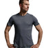A man wearing a dark gray athletic t-shirt and matching gray shorts, standing against a light gray studio background.