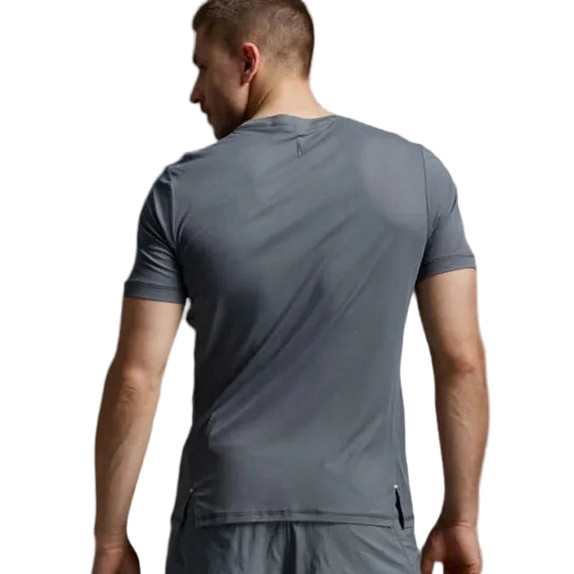 A man shown from the back wearing a dark gray athletic t-shirt and matching gray shorts against a light gray studio background.