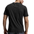 A man viewed from behind wearing a black short-sleeve athletic t-shirt and gray shorts against a light gray studio background.