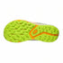Close-up of a shoe sole with green and orange tread pattern on a white background