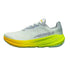White running shoe with yellow sole on a white background