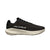 Black trainers with beige soles on a light gray background