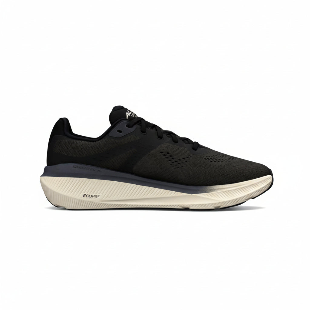 Black running shoe with a beige sole on a white background