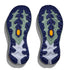 Close-up of a pair of blue and green athletic shoe soles on a white background