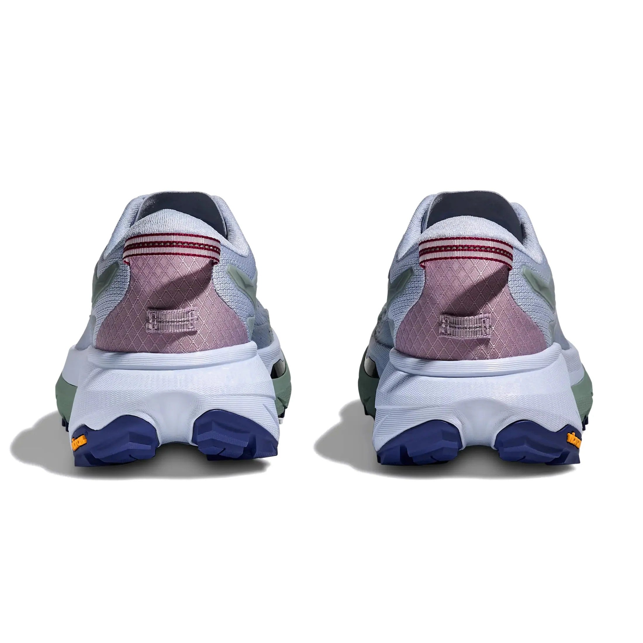 Back view of a pair of sneakers with a white sole and colorful design on a white background