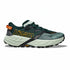 Green running shoe with orange accents on a white background