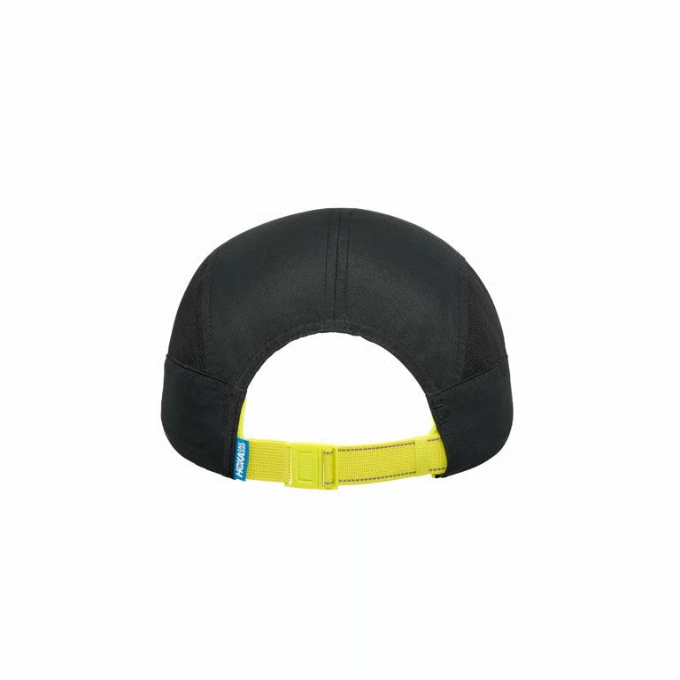 Black cap with a yellow strap on a white background