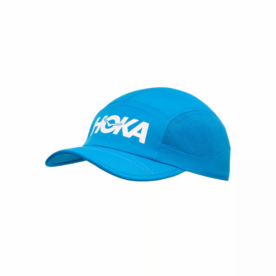 Blue cap with 'Hoka' logo on a white background