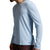 A man wearing a light blue long-sleeve athletic shirt and dark brown shorts, shown from a side profile against a neutral gray studio background.