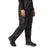 Person wearing black waterproof pants on a white background