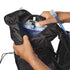 Person setting up a water reservoir in a black Salomon hydration vest
