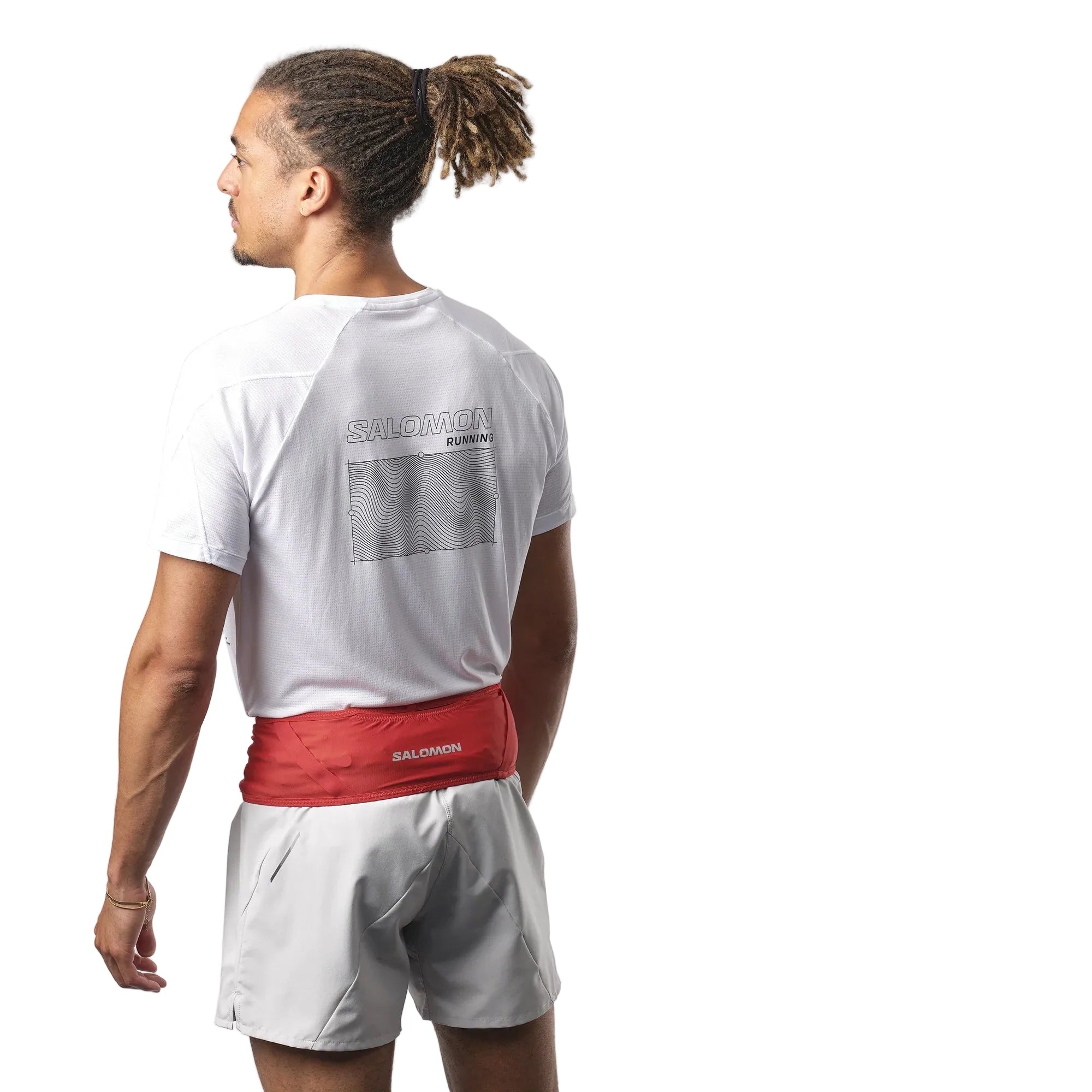Person wearing a white t-shirt and red running belt with 'Salomon' branding on a white background