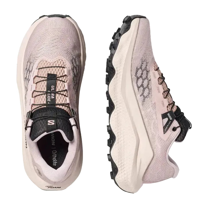 Pair of pink and black trail shoes on a white background