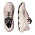 Pair of pink and black trail shoes on a white background