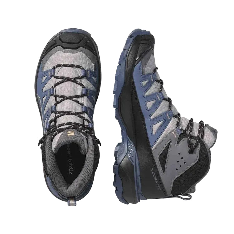 A pair of Salomon mid-height hiking boots shown from the top and side views against a light gray background.