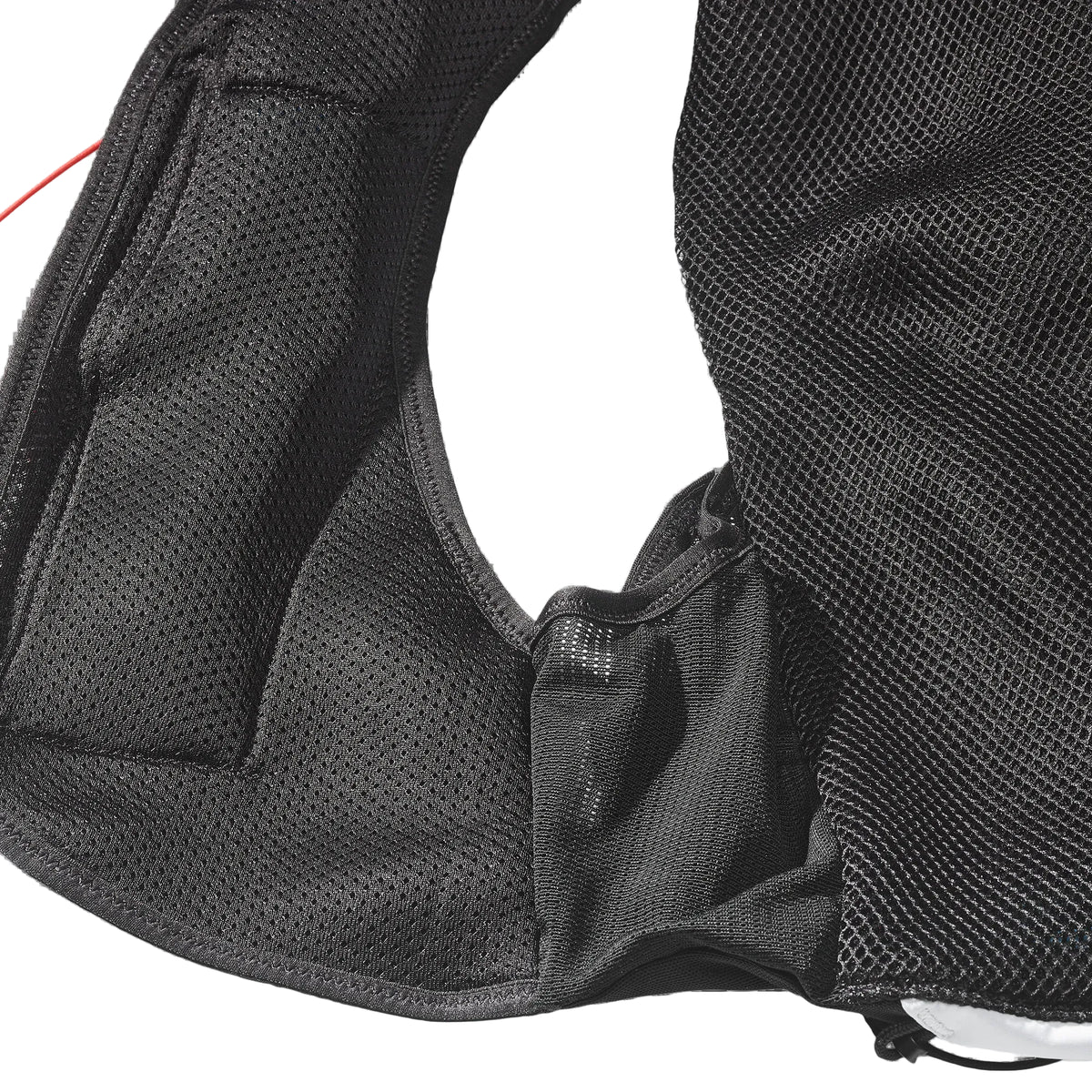 Close-up of a black mesh backpack on a white background
