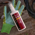 Sawyer Max Deet spray bottle with green gloves on a wooden surface
