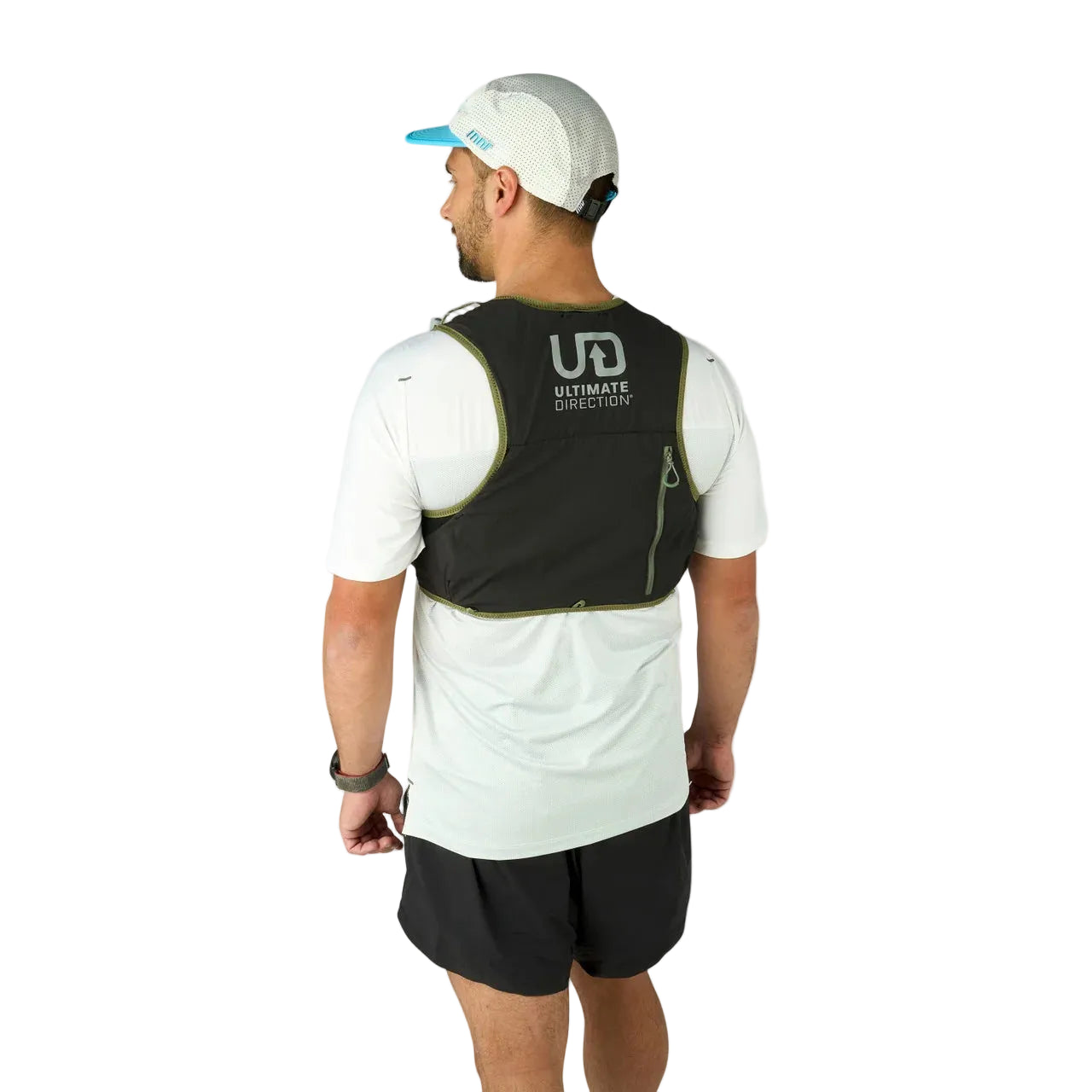 Man wearing a black running vest with 'Ultimate Direction' logo on a light gray background