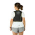 Person wearing a black Ultimate Direction vest on a light gray background