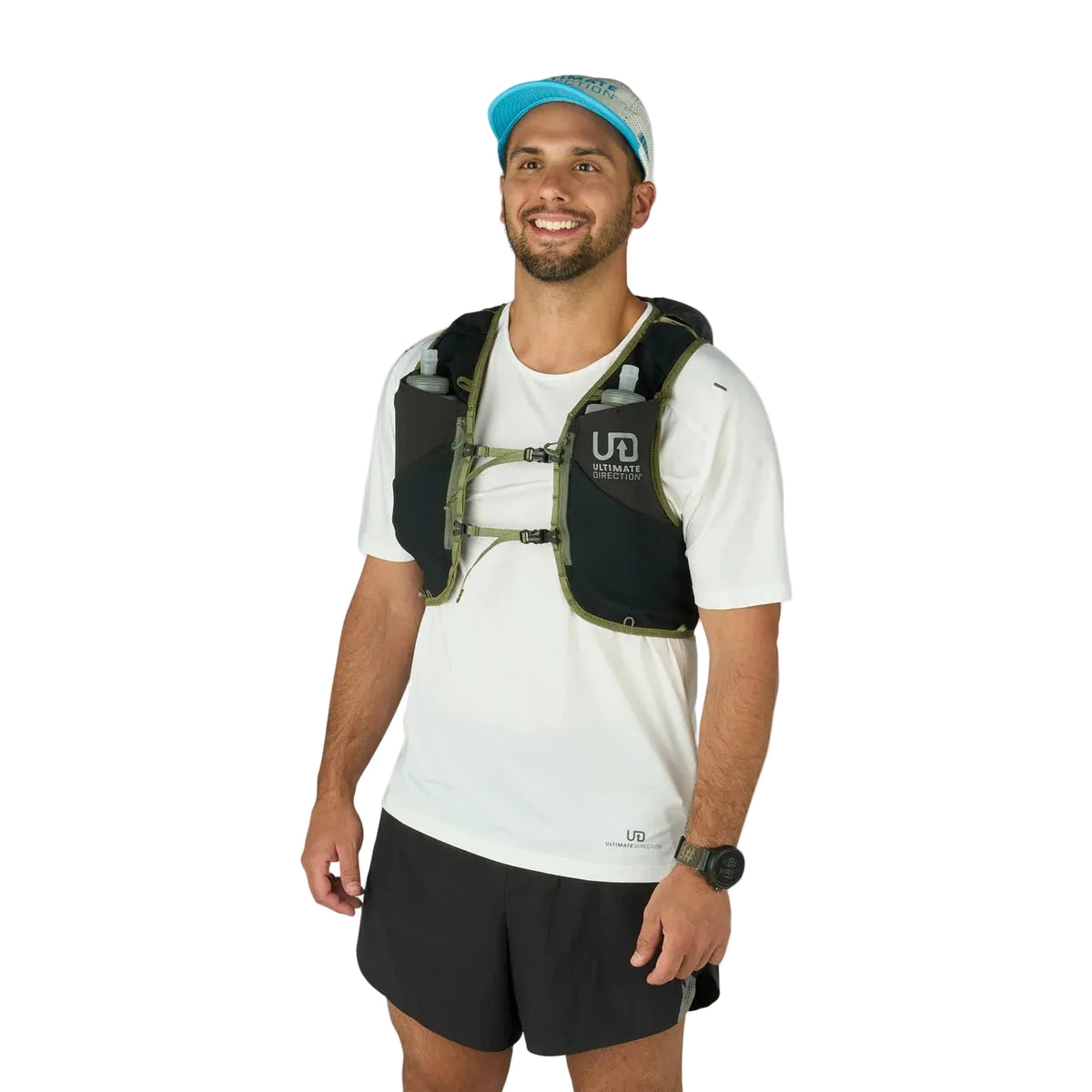 Man wearing a black running vest with water bottles on a white background