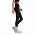 Person wearing black leggings and white sneakers on a light gray background