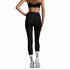 Person wearing black leggings on a gray background