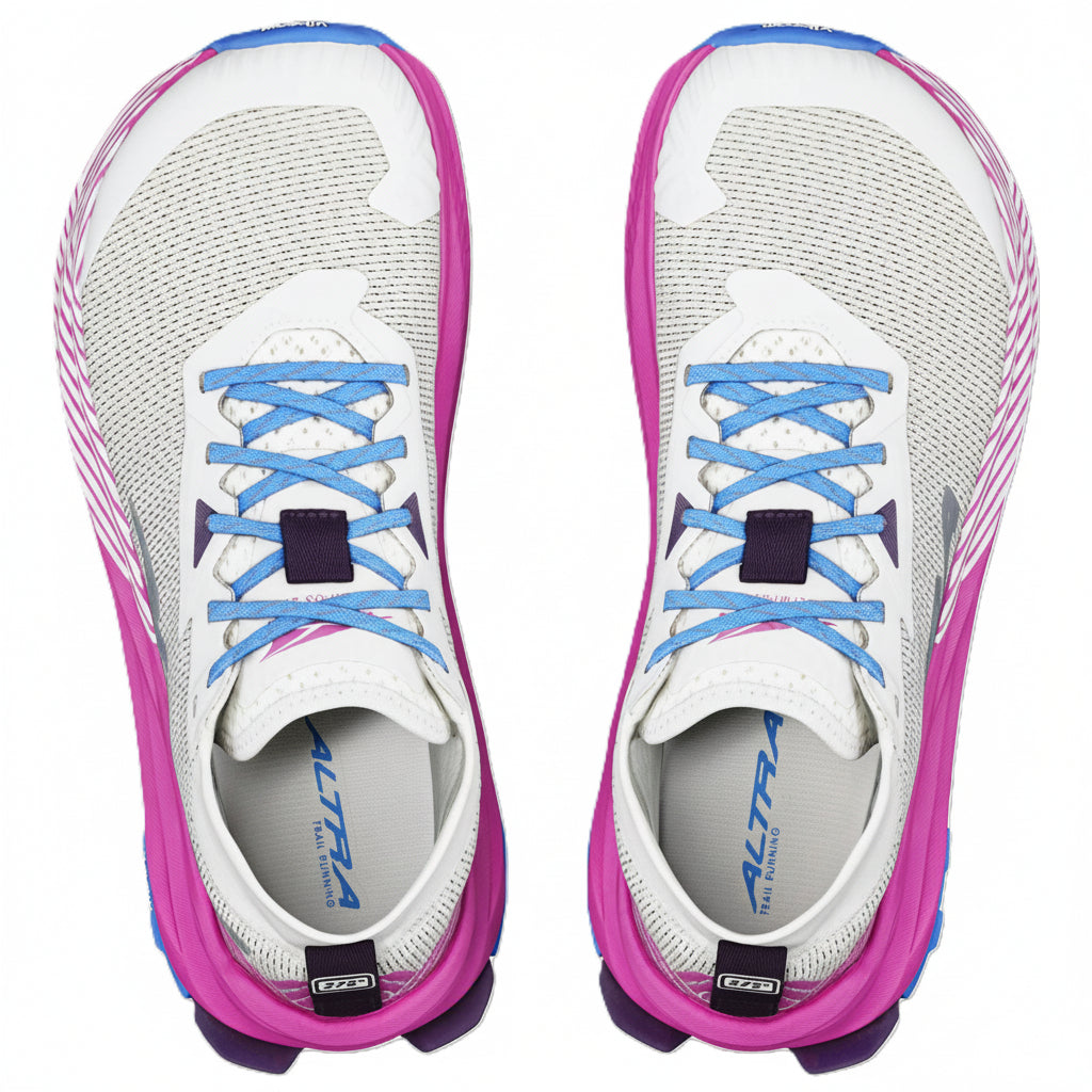 White running shoes with pink sides and blue laces on a white background
