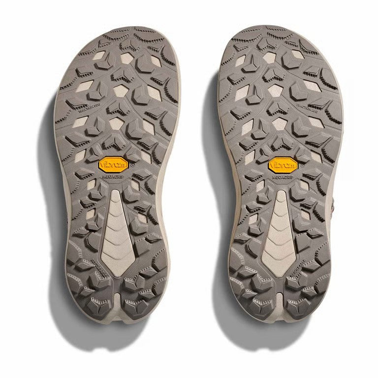 Close-up of the sole of a shoe with brand logo on a white background